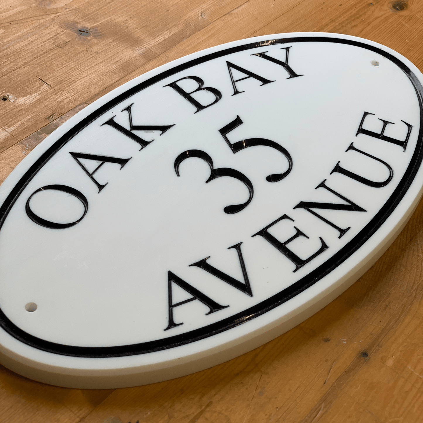 White Oval Corian Sign (315x170mm) - housenumbers.ie