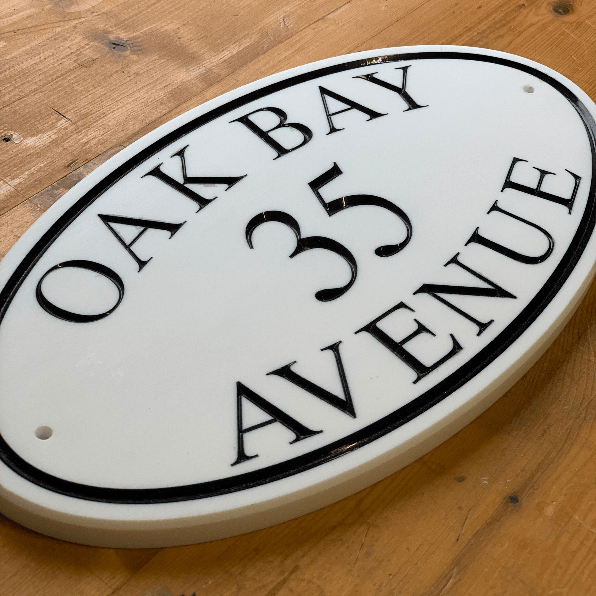 White Oval Corian Sign (315x170mm) - housenumbers.ie
